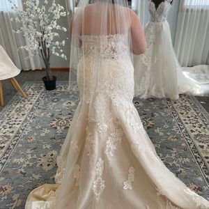 Never worn or altered. Alter to fit your body.